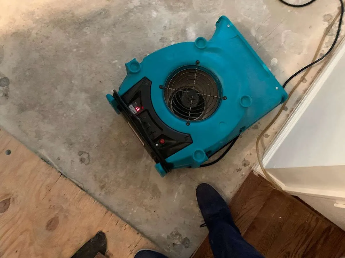 Air mover drying subfloor during Commercial Water Damage Restoration in Jupiter Farms
